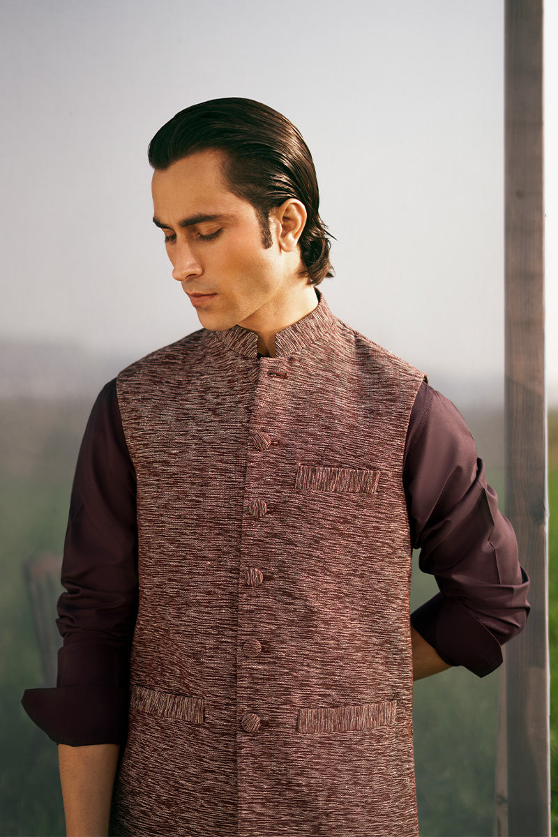 Classic men's waistcoat in maroon color, trendy and fashionable. Best waistcoat design for men in Pakistan.