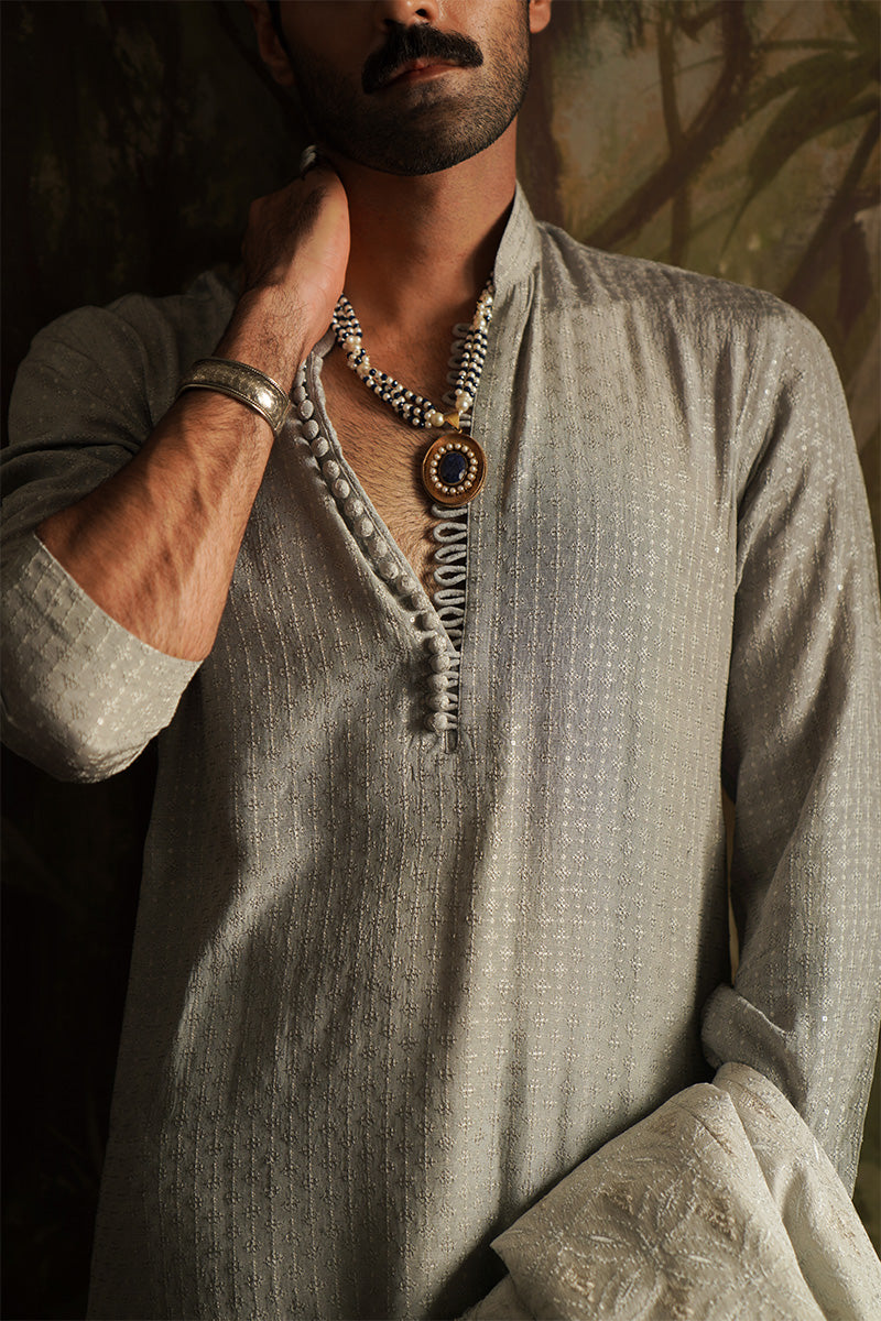 Man wearing a grey kurta pajama se