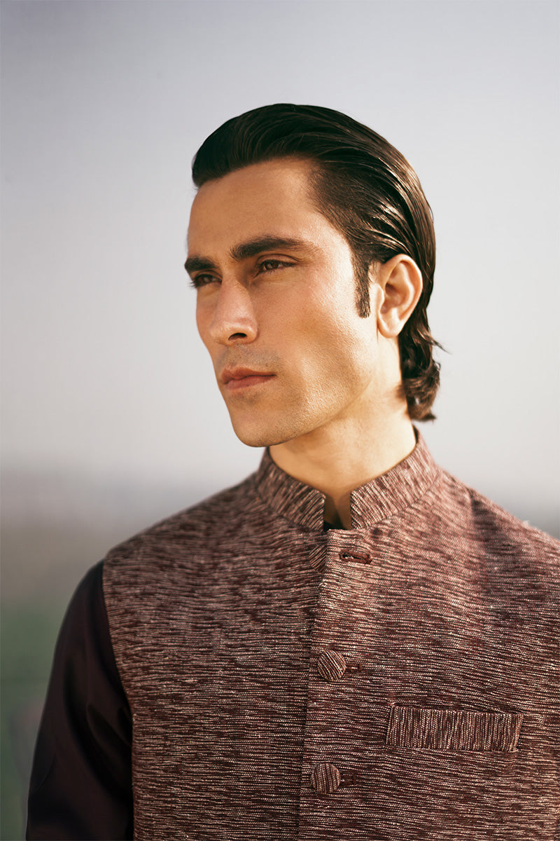 Formal maroon waistcoat design for men, designed for sophisticated Pakistani events and gatherings.