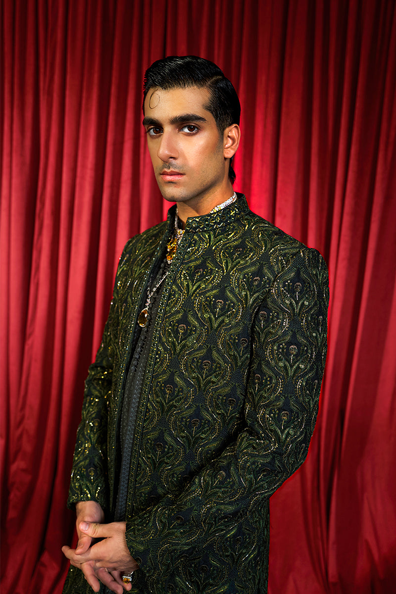 Shop designer embroidered green sherwani for groom with intricate gold detailing, available for online purchase. Perfect traditional attire for weddings and special occasions.