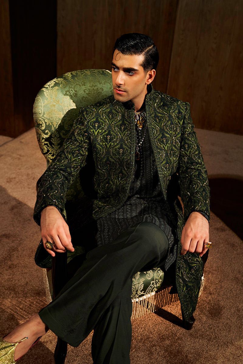Shop designer embroidered green sherwani for groom with intricate gold detailing, available for online purchase. Perfect traditional attire for weddings and special occasions.
