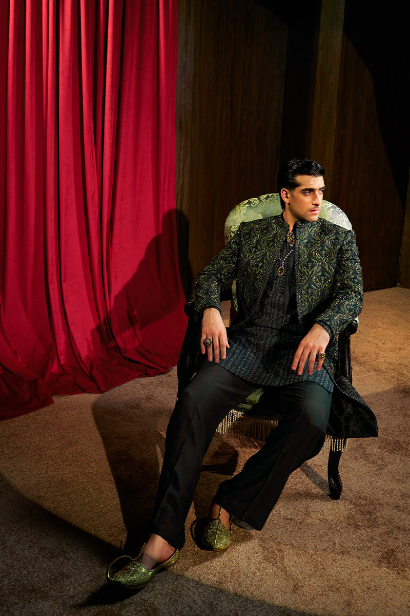 Shop designer embroidered green sherwani for groom with intricate gold detailing, available for online purchase. Perfect traditional attire for weddings and special occasions.