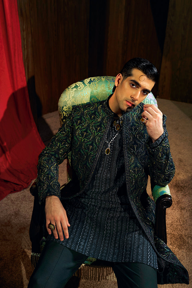 Shop designer embroidered green sherwani for groom with intricate gold detailing, available for online purchase. Perfect traditional attire for weddings and special occasions.