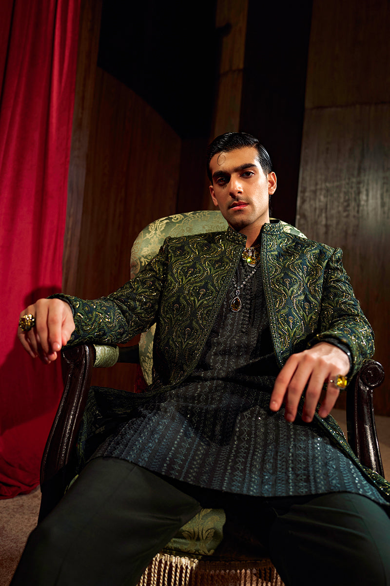 Shop designer embroidered green sherwani for groom with intricate gold detailing, available for online purchase. Perfect traditional attire for weddings and special occasions.