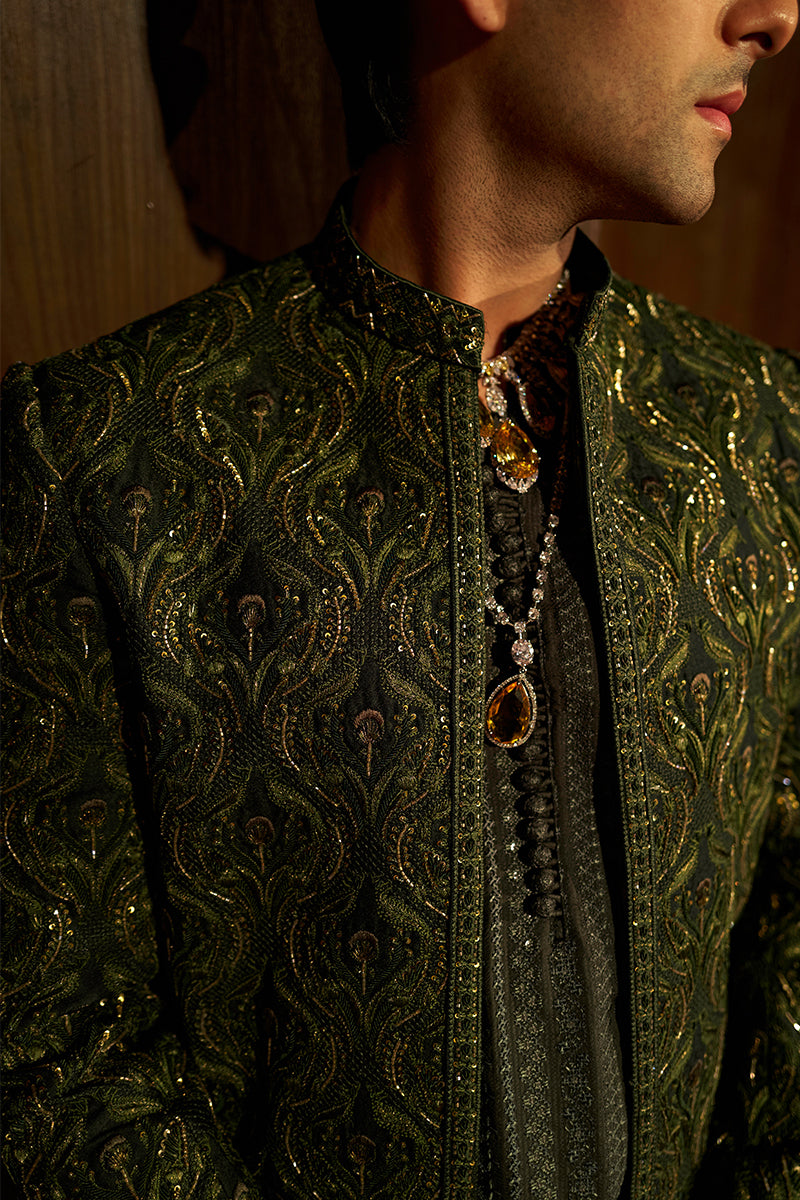 Shop designer embroidered green sherwani for groom with intricate gold detailing, available for online purchase. Perfect traditional attire for weddings and special occasions.