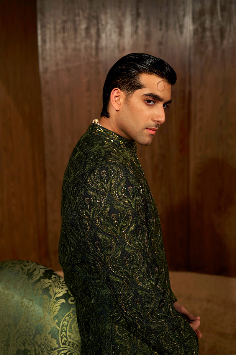 Shop designer embroidered green sherwani for groom with intricate gold detailing, available for online purchase. Perfect traditional attire for weddings and special occasions.