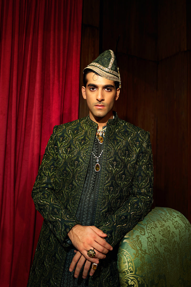 Shop designer embroidered green sherwani for groom with intricate gold detailing, available for online purchase. Perfect traditional attire for weddings and special occasions.
