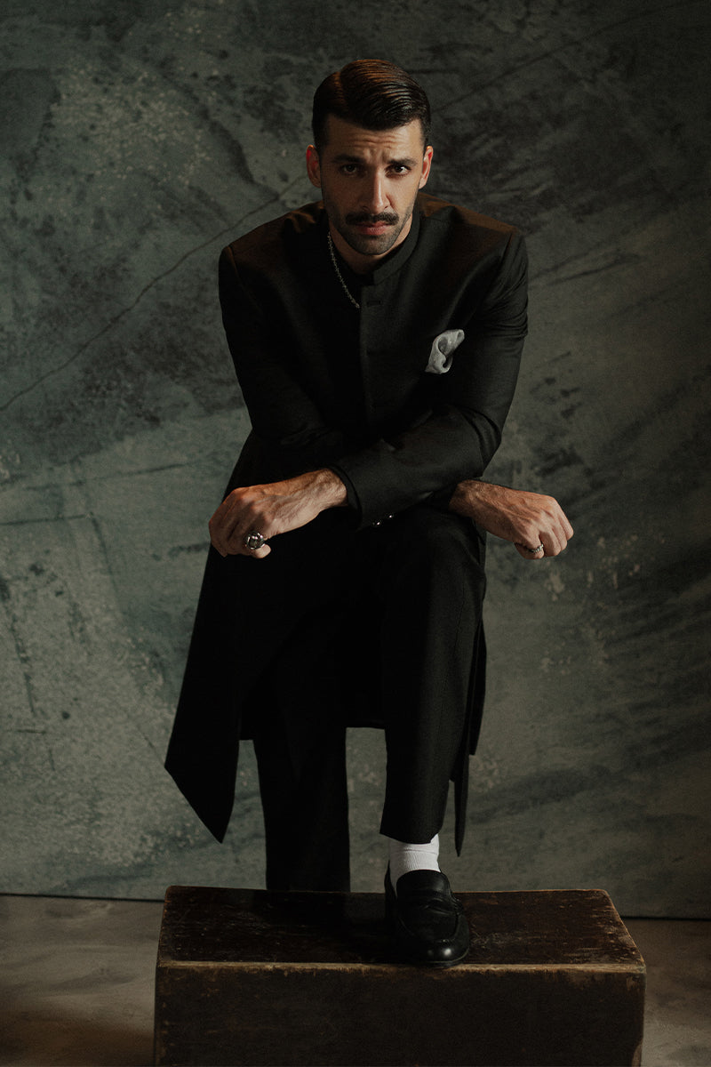 Stylish black sherwani for grooms with subtle embroidery