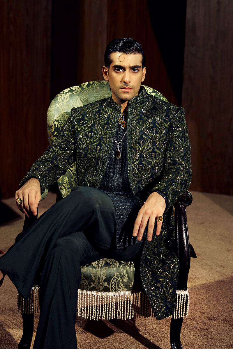 Shop designer embroidered green sherwani for groom with intricate gold detailing, available for online purchase. Perfect traditional attire for weddings and special occasions.