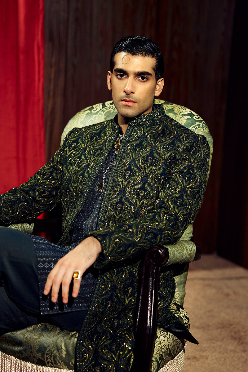 Shop designer embroidered green sherwani for groom with intricate gold detailing, available for online purchase. Perfect traditional attire for weddings and special occasions.