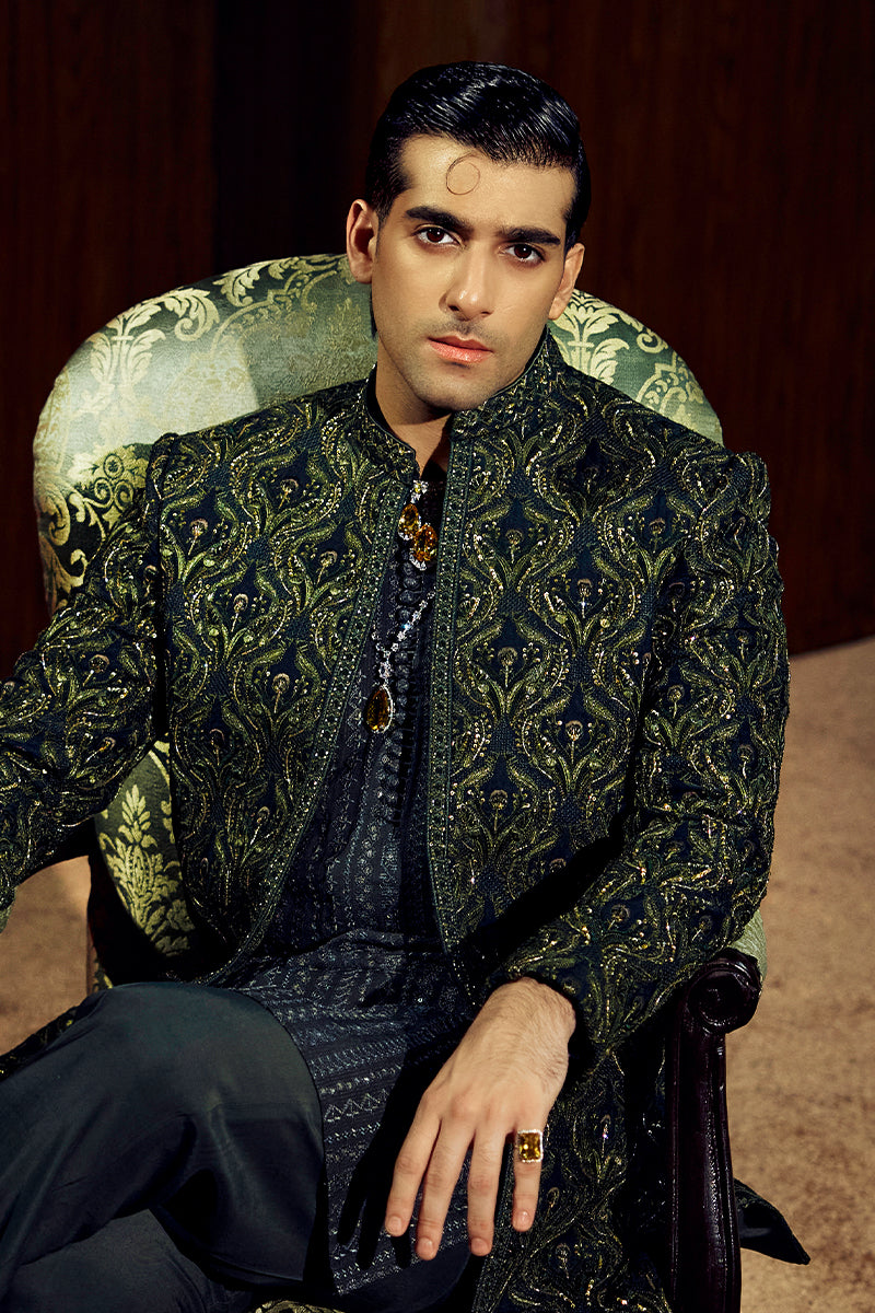 Shop designer embroidered green sherwani for groom with intricate gold detailing, available for online purchase. Perfect traditional attire for weddings and special occasions.