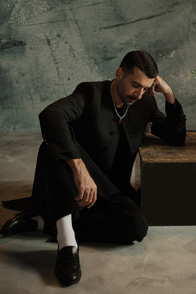 Festive black sherwani for men paired with churidar pants