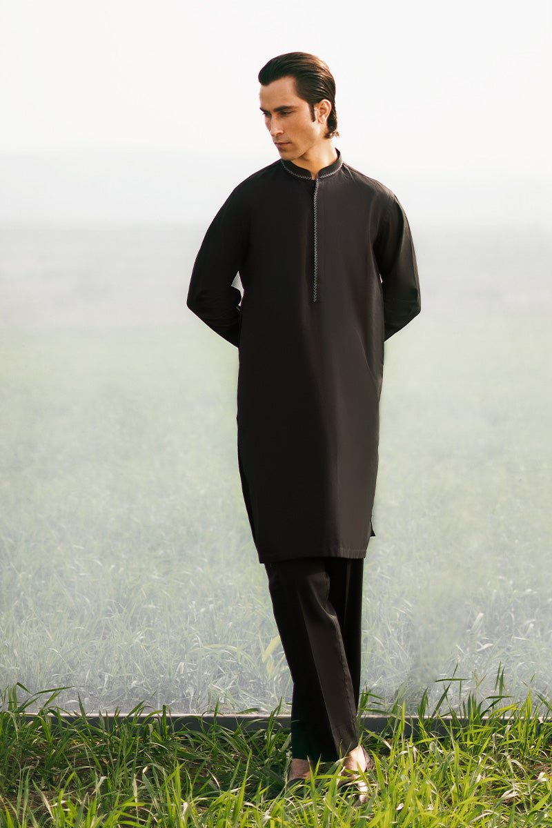 Exclusive designer kurta pajama in black, highlighting sophisticated kurta design aesthetics for men.