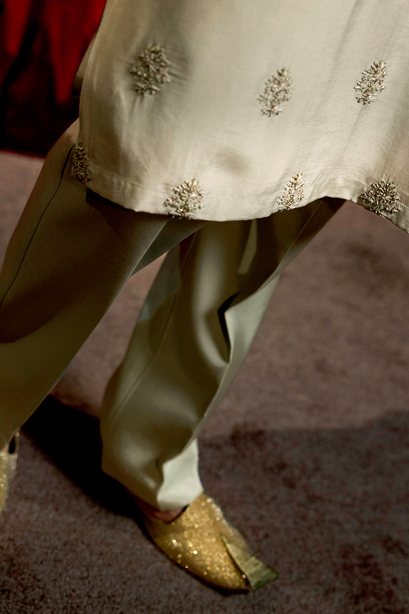 Designer pastel green kurta with waistcoat available online in Pakistan, featuring intricate embroidery and premium fabric, perfect for festive and formal occasions.