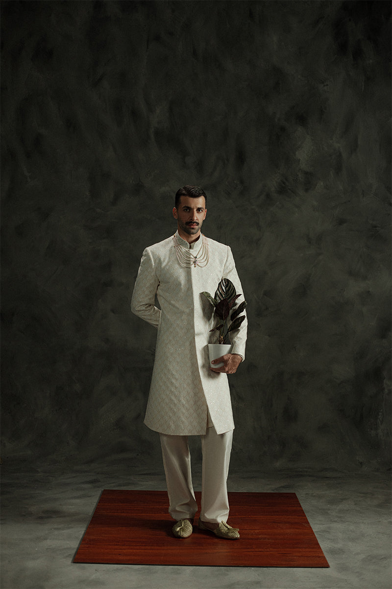 Ivory white wedding sherwani for men with intricate design details