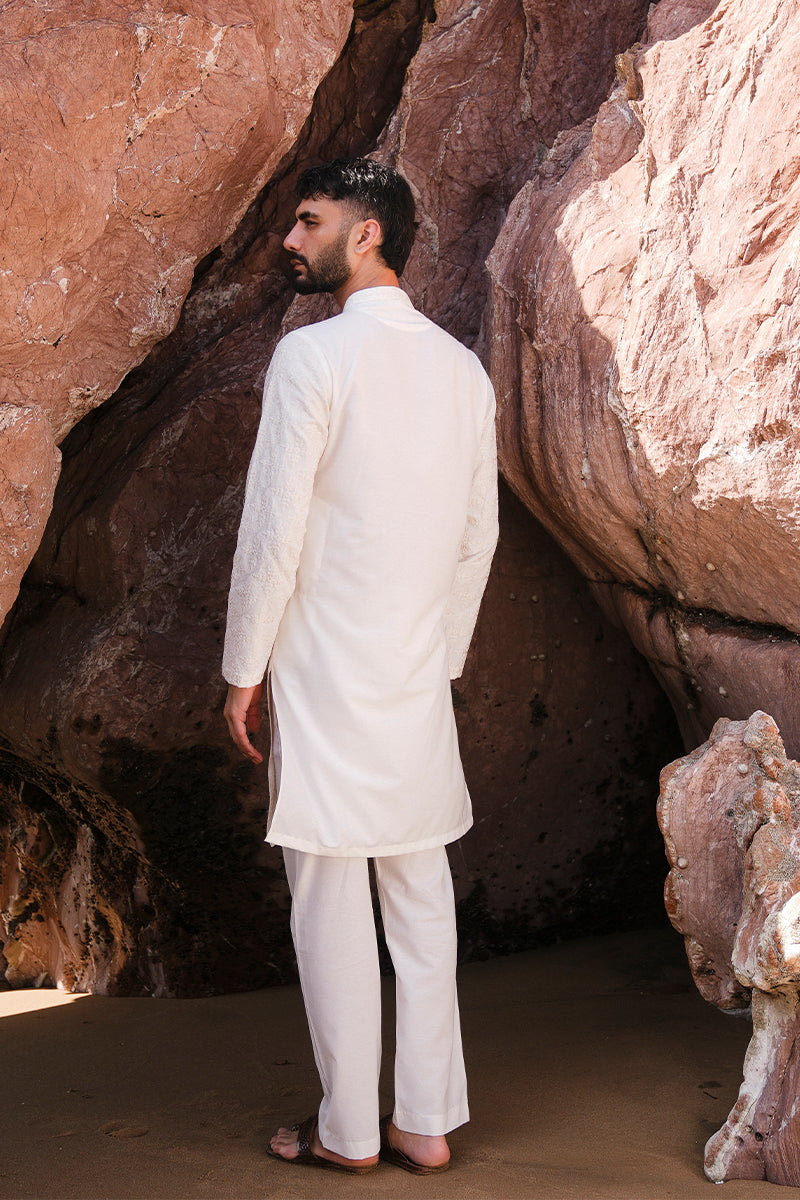 Detailed view of the embroidery work on the ivory white kurta pajama, showcasing premium craftsmanship.
