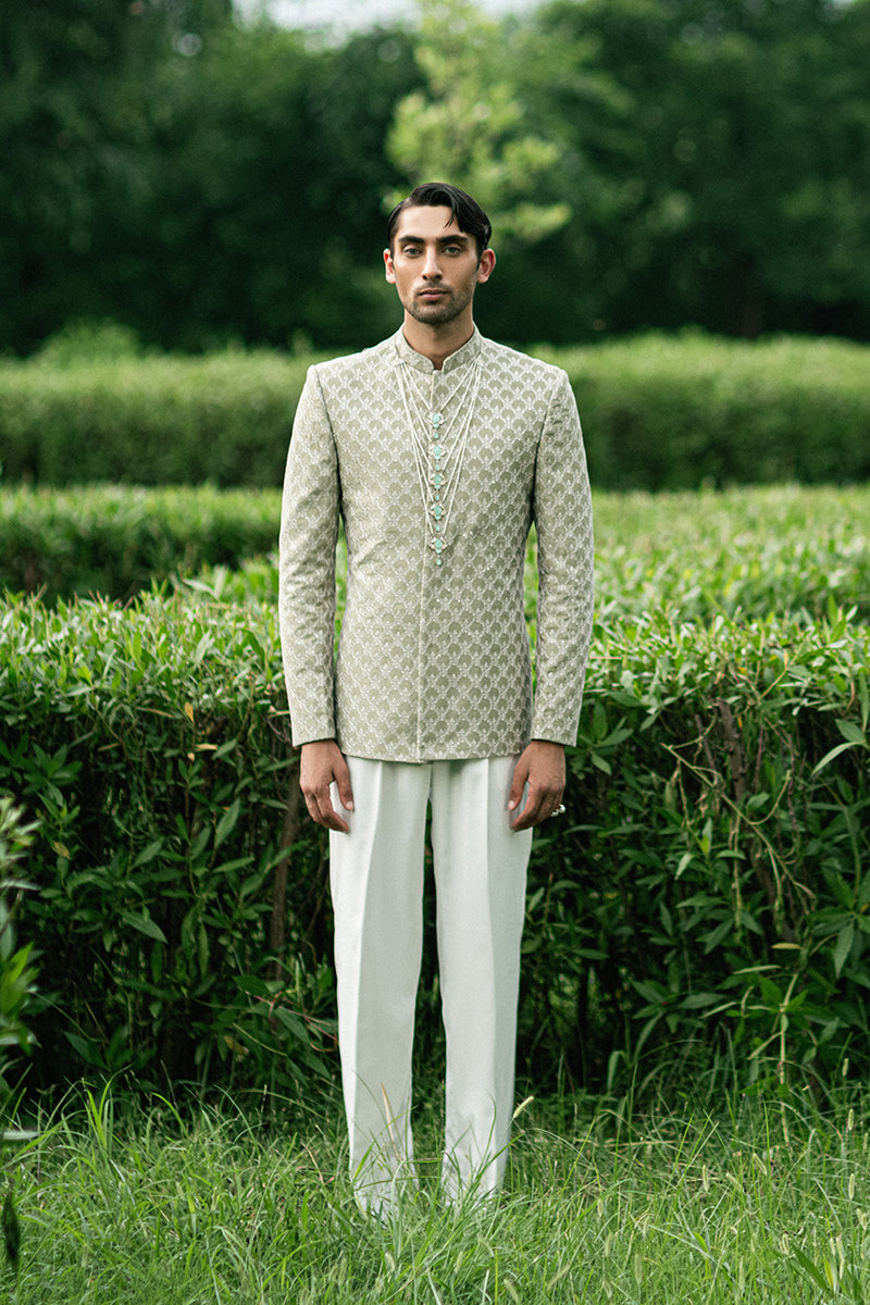 Green prince coat design with traditional embellishments, perfect for weddings and special occasions