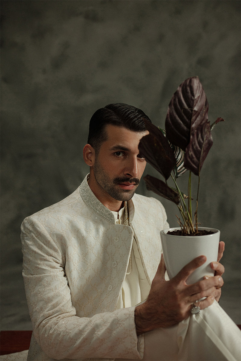 Traditional wedding sherwani for men in a timeless white shade